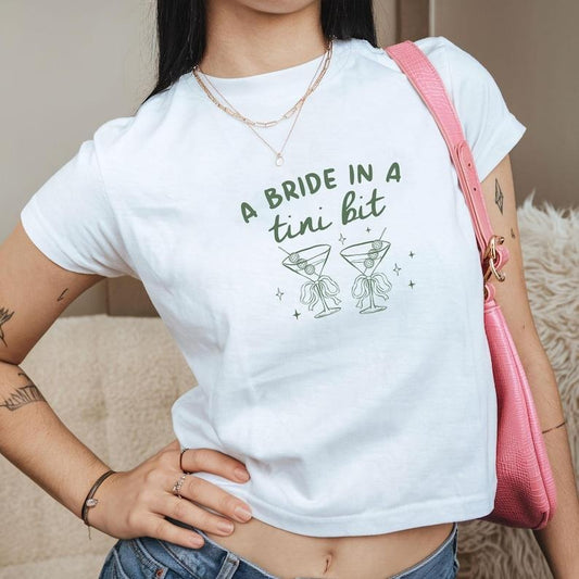 A Bride in A Tini Bit Baby Tee, Bride Shirt Martini Bachelorette Party Croptop, Martini Bride Tee, Gift for Bridesmaid, Trendy Y2K Baby Tee