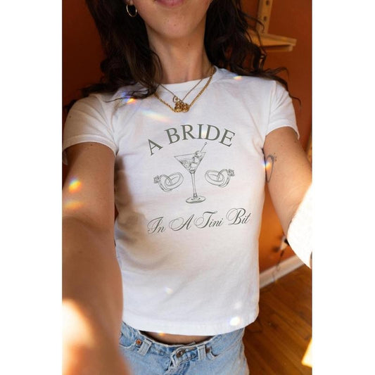 [Sale Up To 20%] A Bride In A Tini Bit Baby Tee, Dirty Martini Themed Bachelorette Party Dirty Martini Bride Baby Tee Casual Comfort
